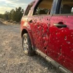 A Bullet-Riddled Vehicle Stands Still — But the Questions Around It Don’t